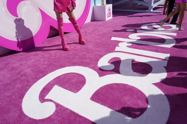 People pose on the red carpet at the premiere of “Barbie” on Sunday, July 9, 2023, at The Shrine Auditorium in Los Angeles. (Photo by Chris Pizzello/AP Photo)