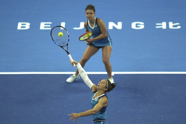 Jasmine Paolini, top, and Sara Errani, both of Italy, play against Chan Hao-Ching of Taiwan and Veronika Kudermetova of Russia during the women's doubles final match at the China Open tennis tournament at the National Tennis Center in Beijing, Sunday, October 6, 2024. (Photo by Ng Han Guan/AP Photo)