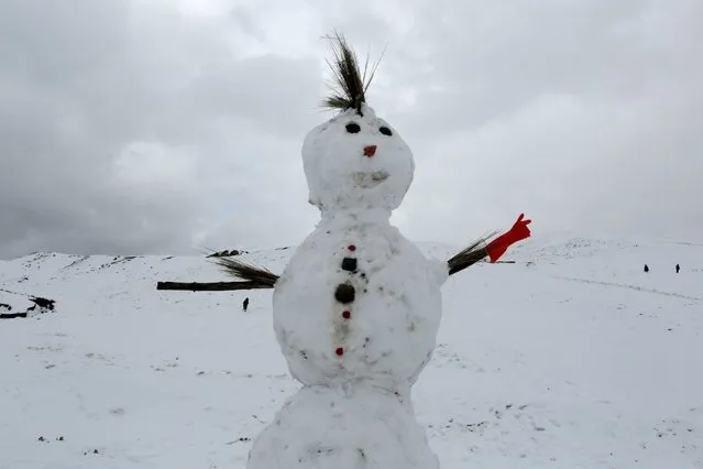 A snowman is seen in La Cumbre, near La Paz, Bolivia August 12, 2015. (Photo by David Mercado/Reuters)