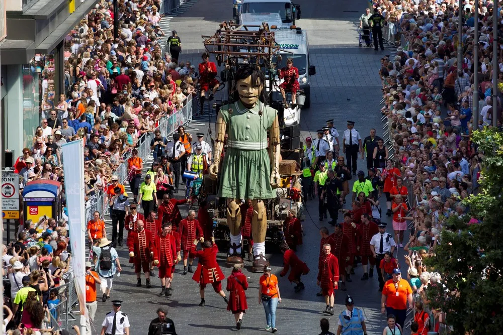 Little Giant Girl Marches through Liverpool