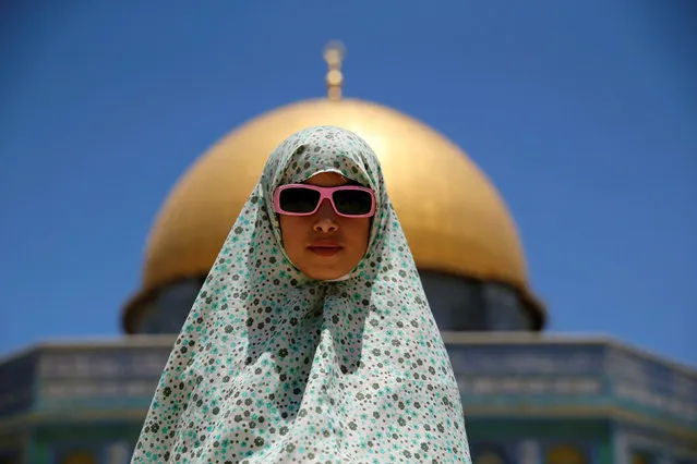 A Palestinian girl prays on the last Friday of the holy fasting month of Ramadan on the compound known to Muslims as Noble Sanctuary and to Jews as Temple Mount in Jerusalem's Old City July 1, 2016. (Photo by Ammar Awad/Reuters)