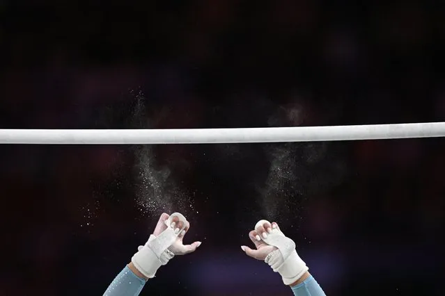 South Africa's Caitlin Rooskrantz slips from the uneven bars in the women's individual all-around final artistic gymnastics event at the Arena Birmingham, on day three of the Commonwealth Games in Birmingham, central England, on July 31, 2022. (Photo by Andy Buchanan/AFP Photo)