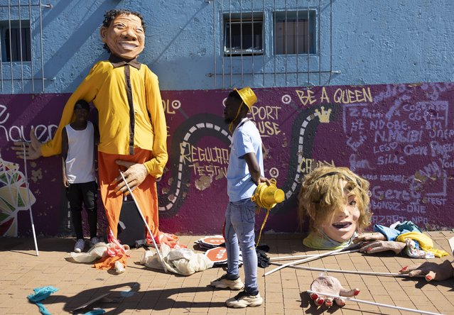 Puppeteer prepare for the annual Orange Farm Carnival, in Johannesburg, South Africa, 01 December 2024. The annual festival aims to bring the community of the township south of Johannesburg together in a spirit of “Ubuntu”, or togetherness. Organized by the Project of Nkosana Ngobese Foundation in Association with the Stretford CHC Clinic, the carnival also raises awareness to the subject of HIV/AIDS and the 16 days of activism highlighting gender-based violence in the community. (Photo by Kim Ludbrook/EPA/EFE)