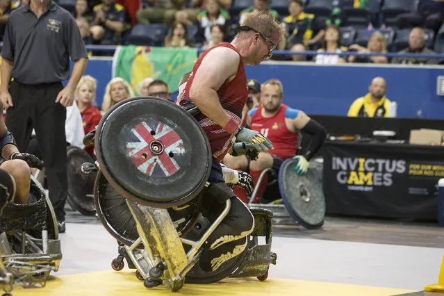 Team United Kingdom's Charlie Walker gets tipped against Team Denmark during the gold medal match in Wheelchair Rugby at the Invictus Games, Thursday, September 28, 2017 in Toronto. (Photo by Chris Young/The Canadian Press via AP Photo)