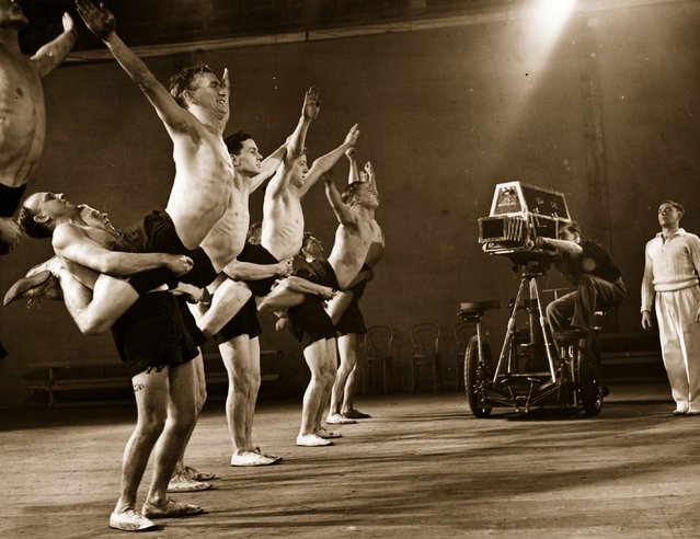 A group of young men, trained gymnasts from the Carnegie Institute, Leeds, taking part in a short instructional and propaganda film being made by the National Fitness Council at Shepherd's Bush studios, London, 22nd February 1939. (Photo by Fred Morley/Fox Photos)