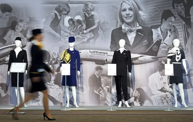 A Lufthansa flight attendant passes a row of  mannequins showing historical flight uniforms at the annual shareholders meeting in Hamburg, Germany, April 29, 2015. (Photo by Fabian Bimmer/Reuters)