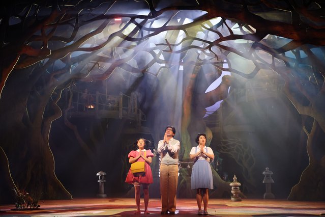 Victoria Chen in the role of Mei, Ami Okumura Jones as Satsuki and Dai Tabuchi as Tatsuo, during scenes from the media call for “My Neighbour Totoro” at the Gillian Lynne Theatre on March 19, 2025 in London, England. (Photo by Neil Mockford/Getty Images)
