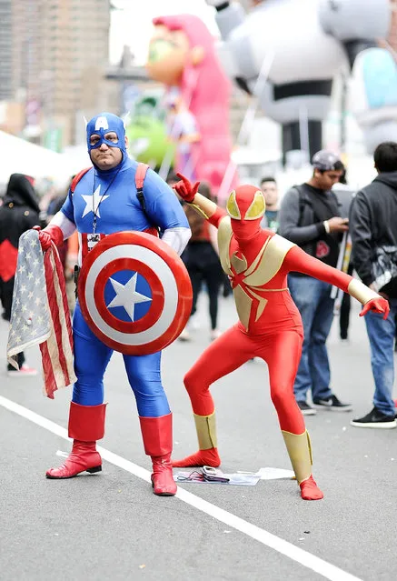 Comic Con attendees pose as Captain America and Spiderman during the 2014 New York Comic Con at Jacob Javitz Center on October 10, 2014 in New York City. (Photo by Daniel Zuchnik/Getty Images)