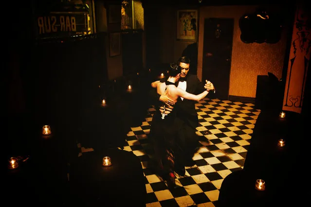 “Tango in the dark”. Tango. Bar Sur. Photo location: Buenos Aires, Argentina. (Photo and caption by Yen Chao/National Geographic Photo Contest)