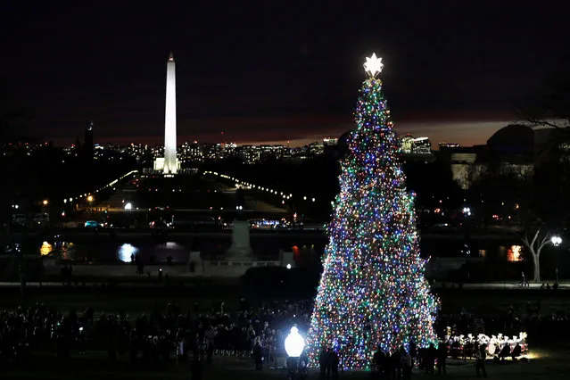 The Capitol Christmas Tree, the 79-foot-tall Engelmann Spruce which was grown in Montana, is lit on West Front Lawn of the U.S. Capitol in Washington, U.S., December 6, 2017. (Photo by Yuri Gripas/Reuters)