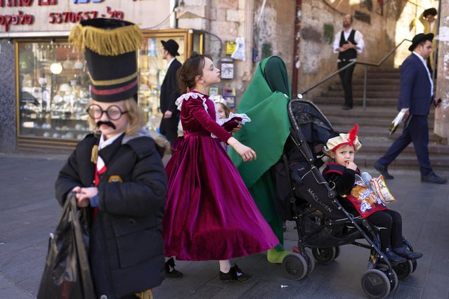 Ultra-Orthodox Jewish kids wear costumes ahead of the Jewish holiday of Purim in Jerusalem, Wednesday, March 12, 2025. (Photo by Ohad Zwigenberg/AP Photo)