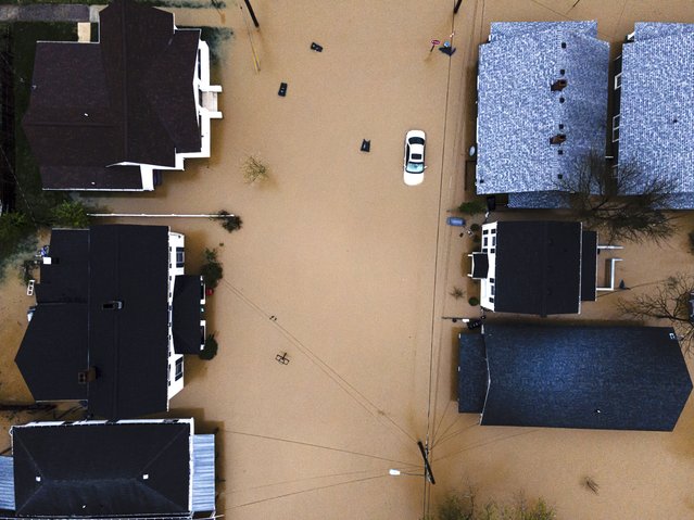 In an aerial view, a flooded neighborhood is seen on Sunday, April 6, 2025, in Frankfort, Ky. (Photo by Jon Cherry/AP Photo)