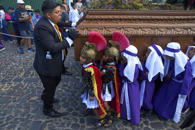 Children carry an image of Jesus Christ at a Holy Week procession in Antigua, Guatemala, Wednesday, April 16, 2025. (Photo by Moises Castillo/AP Photo)
