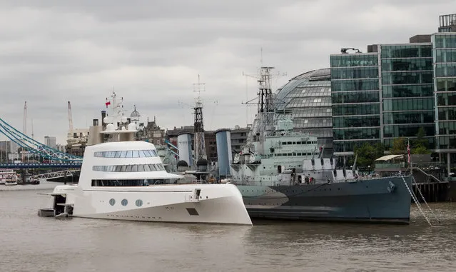 A superyacht, known as Motor Yacht A and owned by Russian billionaire Andrey Melnichenko, moored next to HMS Belfast on the river Thames in London, England on September 6, 2016. The stunning shape is inspired by a submarine and was designed by Philippe Starck. (Photo by Vickie Flores/Rex Features/Shutterstock)