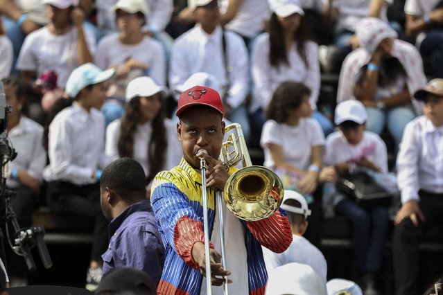 A musician performs during a concert to celebrate the 50th anniversary of the national system of children and youth orchestras of Venezuela in Caracas, February 23, 2025. (Photo by Pedro Mattey/AFP Photo)
