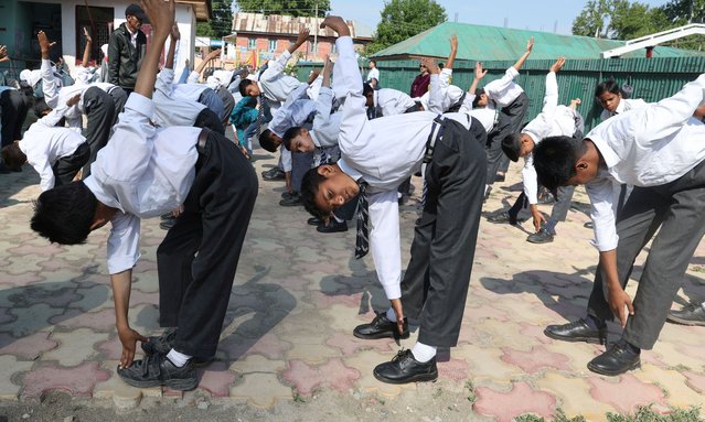 Students exercise during the morning assembly at their school, following its reopening after the Pakistan-India ceasefire, in Srinagar, India, 13 May 2025. Pakistan and India entered a ceasefire on 10 May 2025, following days of military escalation. (Photo by Farooq Khan/EPA/EFE)
