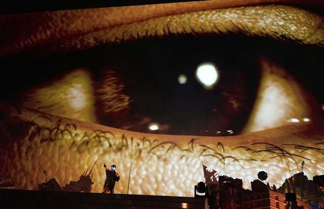 The Weeknd, left, performs underneath a video screen during his concert on Wednesday, June 25, 2025, at SoFi Stadium in Inglewood, Calif. (Photo by Chris Pizzello/AP Photo)