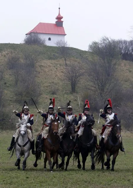 History enthusiasts, dressed as soldiers, fight during the re-enactment of Napoleon's famous battle of Austerlitz near the southern Moravian town of Slavkov u Brna November 29, 2014. (Photo by David W. Cerny/Reuters)