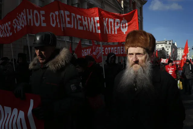 Russian Communist Party supporters attend a rally marking Day of the Fatherland Defender in Moscow, Russia, 23 February 2018. (Photo by Yuri Kochetkov/EPA/EFE)