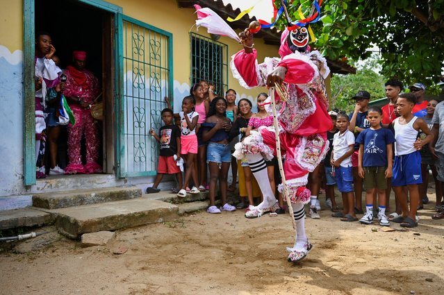 A member of the Brotherhood of the Diablos Danzantes de Chuao (Dancing Devils of Chuao) performs during the Corpus Christi festival in the town of Chuao, Aragua state, Venezuela on June 18, 2025. (Photo by Maxwell Briceno/Reuters)