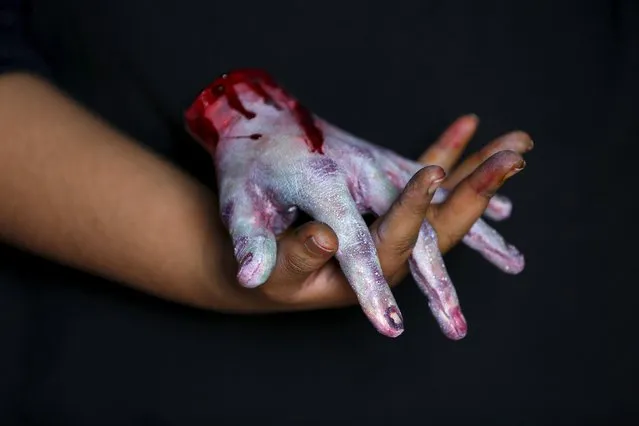 A bloody zombie hand made of gummy candy and red jelly is pictured at the Zombie Gourmet homemade candy manufacturer on the outskirts of Mexico City October 30, 2015. (Photo by Carlos Jasso/Reuters)