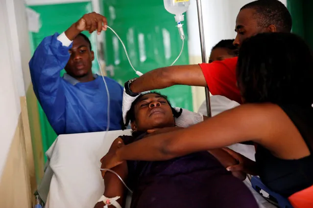 Hospital workers treat a sick patient at the hospital after Hurricane Matthew passed Jeremie, Haiti, October 6, 2016. (Photo by Carlos Garcia Rawlins/Reuters)