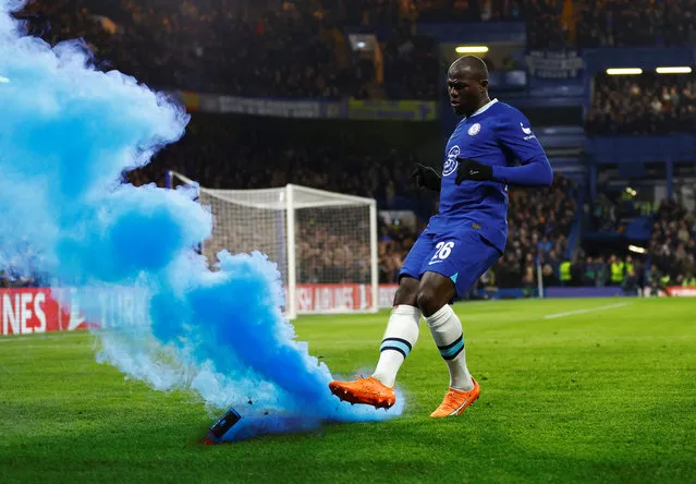 Kalidou Koulibaly of Chelsea kicks a flare during the UEFA Champions League round of 16 leg two match between Chelsea FC and Borussia Dortmund at Stamford Bridge on March 07, 2023 in London, England. (Photo by Peter Cziborra/Action Images via Reuters)