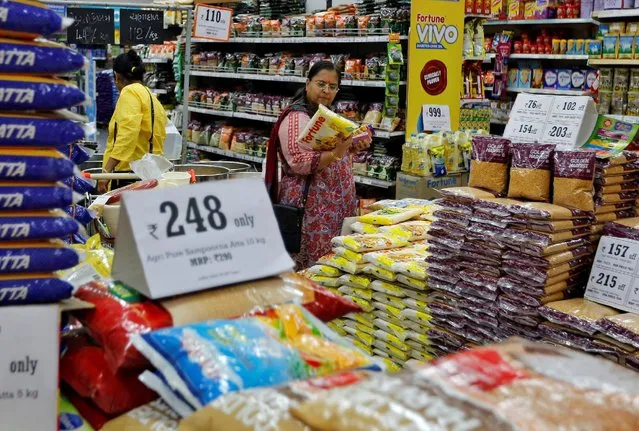 A woman looks at an item as she shops at a food superstore in Ahmedabad, India October 13, 2016. (Photo by Amit Dave/Reuters)