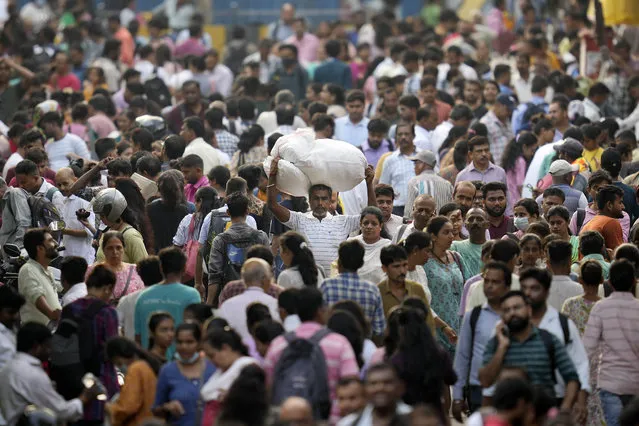 People throng a market place in Mumbai, India, Monday, April 24, 2023. The United Nations says India will be the world's most populous country by the end of April, eclipsing an aging China. (Photo by Rajanish Kakade/AP Photo)