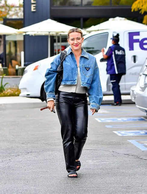 Hilary Duff was spotted radiantly smiling and looking very stylish in a Denim Jacket over black leather pants while out In Studio City, CA on April 20, 2023. The actress was seen having a creative business meeting with some producers before grabbing a cup of coffee on the go. (Photo by @CelebCandidly/The Mega Agency)