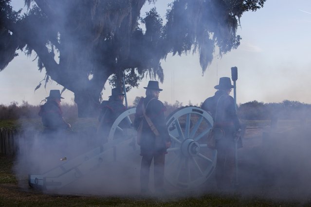 Reenactors playing the roll of United States artillerymen fire a canon during a commemoration of the Battle of New Orleans in the War of 1812, marking its bicentennial in Chalmette, Louisiana January 10, 2015. (Photo by Lee Celano/Reuters)
