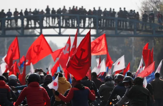 Nepalese supporters of the splinter group in the governing Nepal Communist Party participate in a protest in Kathmandu, Nepal, Tuesday, December 29, 2020. Tens of thousands of supporters of the splinter group rallied in the capital on Tuesday demanding the ouster of the prime minister and the reinstatement of the Parliament he dissolved amid an escalating feud in the party. (Photo by Niranjan Shrestha/AP Photo)