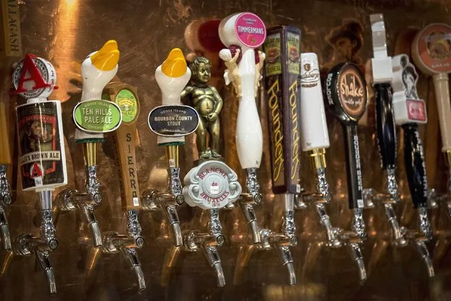 Goose Island beer taps are seen amongst other craft beers at a bar in New York January 21, 2015. Industry body the Brewers Association says craft brewers caught $14.3 billion of a total U.S. beer market of $100 billion in 2013. Yet it also insists craft brewers must be small, independent and traditional and dismisses the likes of AB InBev's Goose Island or MillerCoors' Blue Moon as impostors. (Photo by Brendan McDermid/Reuters)