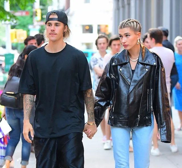 Singer Justin Bieber and model Hailey Baldwin looked like the perfect couple as they left Cipriani's in New York, USA on June 22, 2018. The couple held hands as they left their casual dinner, hopping into an SUV together. They matched in black outfits, Justin wearing a casual shirt and basketball shorts, while Hailey wore an oversized Leather Jacket with her hair neatly braided after an all day photoshoot. Before leaving, they had one last bite of Dessert. Hailey opted for a spoon, while Justin went for the non-traditional finger in the frosting, which he licked off. (Photo by 247PAPS.TV/Splash News and Pictures)