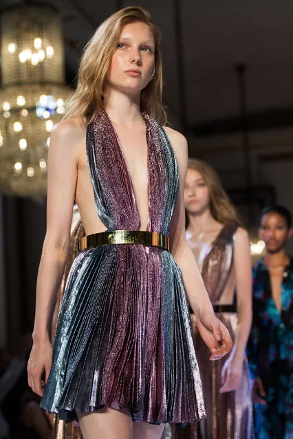 Models present creations from the Fall/Winter 2018/19 Haute Couture collection by French designer Maxime Simoens for Azzaro Couture during the Paris Fashion Week, in Paris, France, 01 July 2018. The presentation of the Haute Couture collections runs from 01 to 05 July. (Photo by Caroline Blumberg/EPA/EFE)