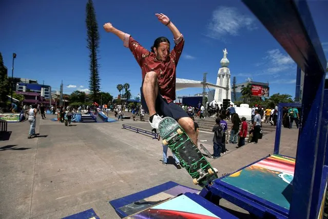 A skateboarder performs a trick during Go Skateboarding Day in San Salvador, El Salvador on June 18, 2023. (Photo by Jose Cabezas/Reuters)
