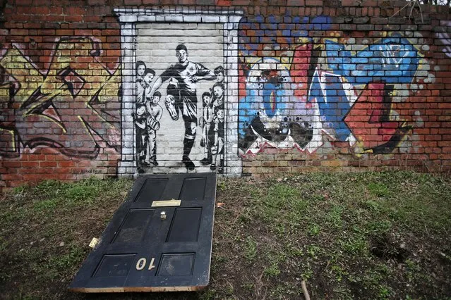 A mural of England soccer player Marcus Rashford kicking down the door of number 10 Downing Street appears on Manchester Canal in Manchester, Britain, March 21, 2021. (Photo by Molly Darlington/Reuters)