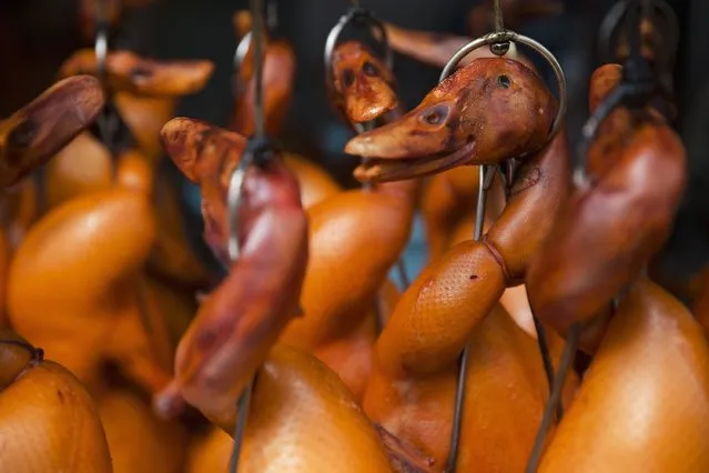 Ducks are prepared for traditional dishes as people celebrate Chinese Lunar New Year in Bangkok's Chinatown February 19, 2015. (Photo by Damir Sagolj/Reuters)