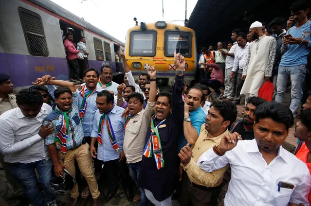 Supporters of Maharashtra Navnirman Sena (MNS) party shout slogans as they block a railway track during a protest against record high petrol and diesel prices in Mumbai, September 10, 2018. (Photo by Francis Mascarenhas/Reuters)