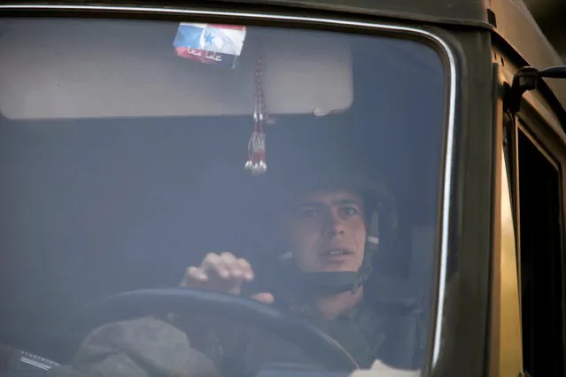 A Russian soldier drives a military vehicle in Aleppo, Syria December 4, 2016. (Photo by Omar Sanadiki/Reuters)