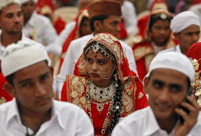 Brides and grooms take part in a mass marriage ceremony in Ahmedabad, India, January 22, 2016. (Photo by Amit Dave/Reuters)