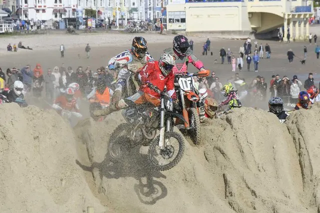 Motocross riders compete on the beach on October 15, 2023 in Weymouth, United Kingdom.  (Photo by Graham Hunt/BNPS)