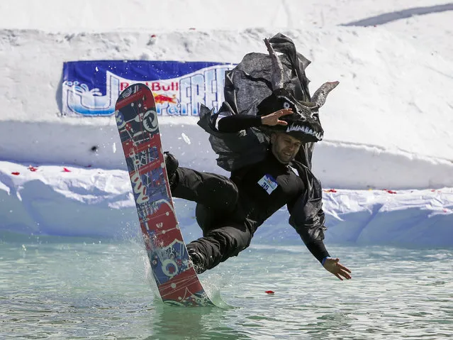 A snowboarder performs during the Red Bull Jump and Freeze contest at ski resort Shimbulak outside Almaty, Kazakhstan, March 22, 2016. (Photo by Shamil Zhumatov/Reuters)
