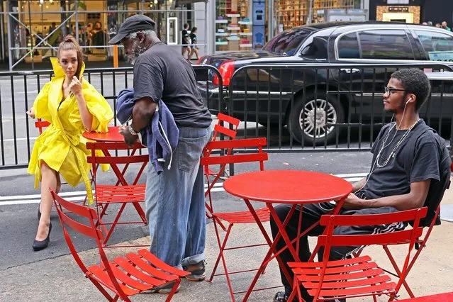 “Model rebuffs panhandler after he has the audacity to trespass on her aura...﻿” (Rich Docherty)