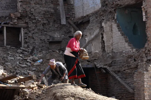 Kanchan Khyamali, 73, and his wife Krishna Kumari Khyamali collect bricks from damaged buildings in Bhaktapur, Nepal, Thursday, May 14, 2015. (Photo by Bikram Rai/AP Photo)