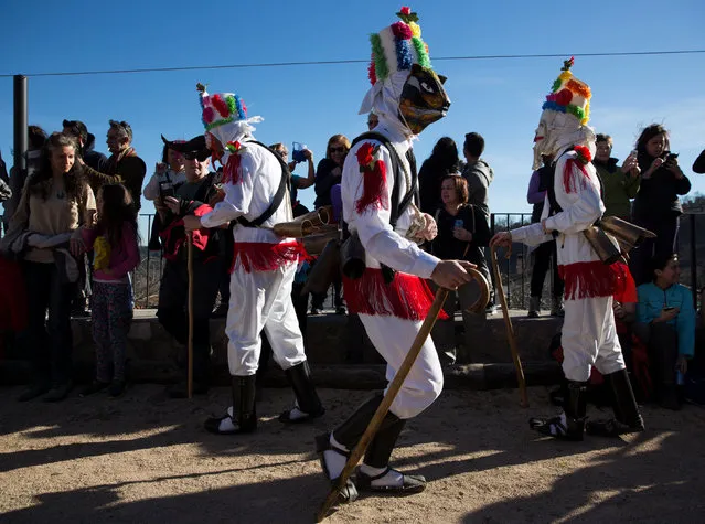 Revellers dressed as “Botargas” dance during carnival celebrations in Almiruete, Spain, February 25, 2017. (Photo by Sergio Perez/Reuters)