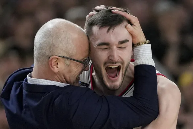 UConn head coach Dan Hurley celebrates with forward Alex Karaban (11) after their win against Purdue in the NCAA college Final Four championship basketball game, Monday, April 8, 2024, in Glendale, Ariz. (Photo by David J. Phillip/AP Photo)