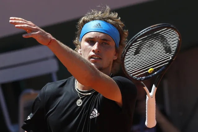 Germany's Alexander Zverev throws his racket after missing a shot against Serbia's Dusan Lajovic during their third round match of the French Open tennis tournament at the Roland Garros stadium in Paris, Saturday, June 1, 2019. (Photo by Pavel Golovkin/AP Photo)