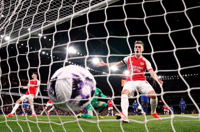 Arsenal's Leandro Trossard reacts after team-mate Ben White (centre background) scored their side's fifth goal of the game during the Premier League match at the Emirates Stadium, London on Tuesday, April 23, 2024. (Photo by Zac Goodwin/PA Images via Getty Images)