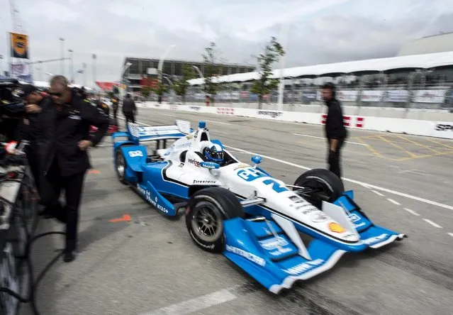 Juan Pablo Montoya, of Colombia, exits the pits during practice for the IndyCar auto race Saturday, June 13, 2015, in Toronto. (Aaron Vincent Elkaim/The Canadian Press via AP)